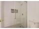 Shower features glass doors and tiled walls at 6475 S Dayton St # 102, Englewood, CO 80111