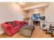 Bedroom with carpet, a comfortable seating area, crib, and natural light at 8002 Galileo Way, Littleton, CO 80125