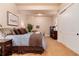 Bedroom with light-colored walls, carpet floors, closet, and neutral decor at 8002 Galileo Way, Littleton, CO 80125