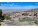 Scenic view of luxury homes, a serene lake, and rolling hills in a beautiful community at 8002 Galileo Way, Littleton, CO 80125