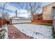 Large fenced backyard with lush green grass and mature trees, offering privacy and space at 1563 N Lafayette St, Denver, CO 80218