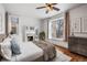 Bedroom with hardwood floors, fireplace, and decorative window at 1563 N Lafayette St, Denver, CO 80218