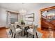 Dining room with hardwood floors and modern chandelier at 1563 N Lafayette St, Denver, CO 80218
