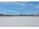 Scenic view of park near home featuring a frozen lake and historic building with city skyline beyond at 1563 N Lafayette St, Denver, CO 80218