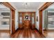 Foyer with wood detailing, chandelier, and hardwood floors at 1563 N Lafayette St, Denver, CO 80218