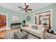 Bright living room with a fireplace and hardwood floors at 1563 N Lafayette St, Denver, CO 80218
