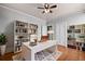 Office with built-in bookshelves, a white desk, and hardwood floors at 1563 N Lafayette St, Denver, CO 80218