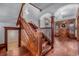 Beautiful wooden staircase with detailed trim and a chandelier in the entryway at 1563 N Lafayette St, Denver, CO 80218