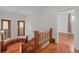 Wooden staircase with detailed banister and natural light from windows at 1563 N Lafayette St, Denver, CO 80218