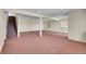 Unfinished basement with carpeted floor and multiple windows at 23405 E Elmhurst Pl, Aurora, CO 80016