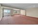 Spacious unfinished basement with sliding door access to outside at 23405 E Elmhurst Pl, Aurora, CO 80016