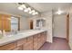 Bathroom boasts double sinks and wood cabinets at 23405 E Elmhurst Pl, Aurora, CO 80016