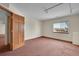 Simple bedroom with carpeted floor and window view at 23405 E Elmhurst Pl, Aurora, CO 80016