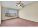 Large bedroom with window and plush carpeting at 23405 E Elmhurst Pl, Aurora, CO 80016