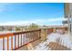 Deck overlooks a snowy landscape and residential area at 23405 E Elmhurst Pl, Aurora, CO 80016