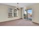 Dining area with sliding glass doors leading to a deck at 23405 E Elmhurst Pl, Aurora, CO 80016