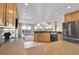 Modern kitchen with breakfast bar and views to backyard at 23405 E Elmhurst Pl, Aurora, CO 80016