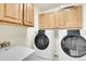 Laundry room with washer, dryer, and upper cabinets at 23405 E Elmhurst Pl, Aurora, CO 80016