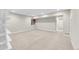 Finished basement with neutral carpeting, recessed lighting, and ample open space, perfect for recreation or entertainment at 11150 E 26Th Ave, Aurora, CO 80010