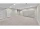 Spacious finished basement offers ample room with plush carpeting and recessed lighting for versatile usage at 11150 E 26Th Ave, Aurora, CO 80010