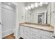 Bathroom features double sink vanity, stylish fixtures, and tiled shower-tub combo at 11150 E 26Th Ave, Aurora, CO 80010