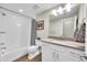 Bright bathroom featuring a tub, white tiled walls, and vanity with modern fixtures for a clean and refreshing feel at 11150 E 26Th Ave, Aurora, CO 80010