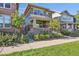 Charming two-story home with a welcoming porch and lush landscaping at 11150 E 26Th Ave, Aurora, CO 80010