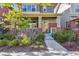 Inviting front exterior with a charming porch and beautifully landscaped yard at 11150 E 26Th Ave, Aurora, CO 80010