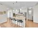 Modern kitchen with white cabinets, stainless steel appliances, and a large island at 11150 E 26Th Ave, Aurora, CO 80010