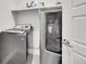 Laundry room featuring modern washer and dryer units with ample storage space at 11150 E 26Th Ave, Aurora, CO 80010