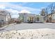 House exterior and snowy backyard view at 458 Whitetail Cir, Lafayette, CO 80026