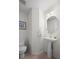 Clean bathroom with pedestal sink and a large mirror at 458 Whitetail Cir, Lafayette, CO 80026