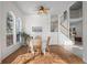 Bright dining room with hardwood floors and a charming wooden table and chairs at 458 Whitetail Cir, Lafayette, CO 80026