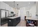 Modern kitchen with center island and stainless steel appliances at 458 Whitetail Cir, Lafayette, CO 80026