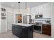 Modern kitchen with stainless steel appliances and an island at 458 Whitetail Cir, Lafayette, CO 80026