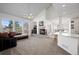 Cozy living room with a fireplace, large windows, and ample seating at 458 Whitetail Cir, Lafayette, CO 80026