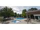 Community pool with lounge chairs and a spa at 458 Whitetail Cir, Lafayette, CO 80026