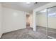 Bright basement room with neutral carpeting and mirrored closet, providing ample storage space at 110 E 104Th Pl, Northglenn, CO 80233