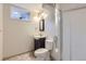 Bathroom area featuring a glass shower, sink, toilet, mirror, window, and modern lighting at 110 E 104Th Pl, Northglenn, CO 80233