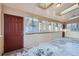 Bright sunroom with ample natural light streaming through large windows and multiple entry doors at 110 E 104Th Pl, Northglenn, CO 80233