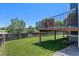 Lush green backyard with a wood fence, perfect for outdoor activities and relaxation at 12491 E 106Th Pl, Commerce City, CO 80022