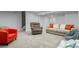 Cozy finished basement with neutral colors, plush carpet, and comfortable seating for relaxing or entertaining at 12491 E 106Th Pl, Commerce City, CO 80022