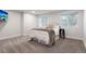Bright bedroom with neutral walls, plush carpet, and plenty of natural light from two windows at 12491 E 106Th Pl, Commerce City, CO 80022