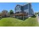 Beautiful home exterior featuring a spacious deck and a well-maintained backyard perfect for outdoor living at 12491 E 106Th Pl, Commerce City, CO 80022