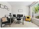 Inviting home office featuring a bright window and comfortable seating area at 12491 E 106Th Pl, Commerce City, CO 80022