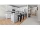 Modern kitchen with stainless steel appliances, granite countertops, and breakfast bar at 12491 E 106Th Pl, Commerce City, CO 80022