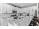 Spacious kitchen with stainless appliances, granite counters and ample counter space at 12491 E 106Th Pl, Commerce City, CO 80022