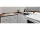 Laundry room featuring a utility sink, counter space, and a new washer and dryer at 12491 E 106Th Pl, Commerce City, CO 80022