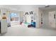 Spacious playroom with ample natural light and open space for activities at 12491 E 106Th Pl, Commerce City, CO 80022