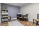 Functional room featuring vinyl floors and gray accent wall, perfect for office, playroom, or storage at 12491 E 106Th Pl, Commerce City, CO 80022